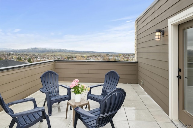 11350 W Grand Ave, Littleton, CO 80127 - balcony featuring a mountain view and a patio area