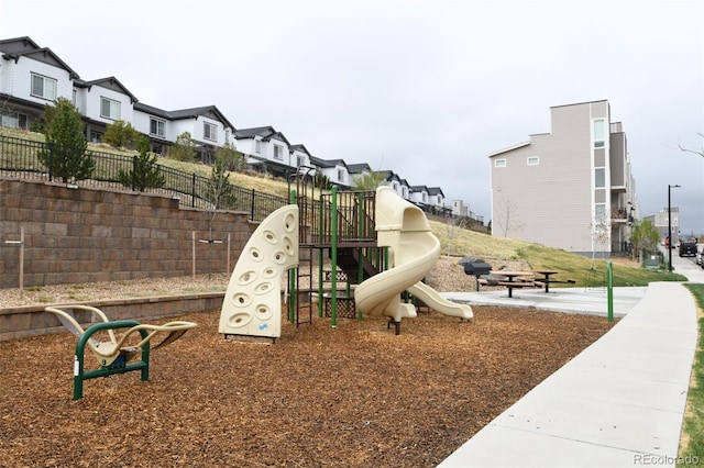 11350 W Grand Ave, Littleton, CO 80127 - community play area with a residential view and fence