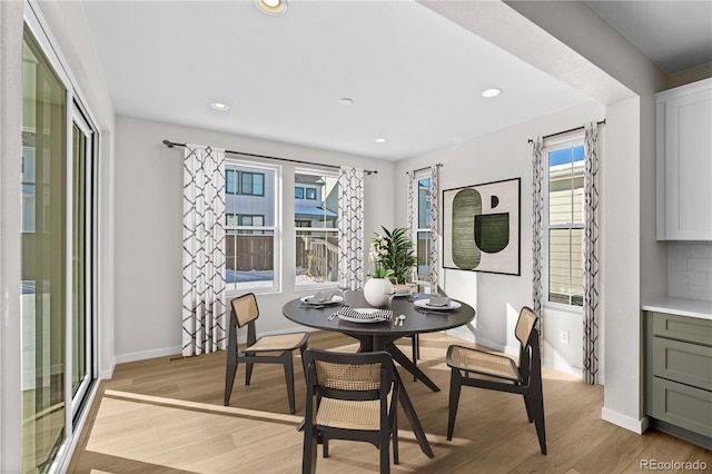 dining space featuring light hardwood / wood-style flooring