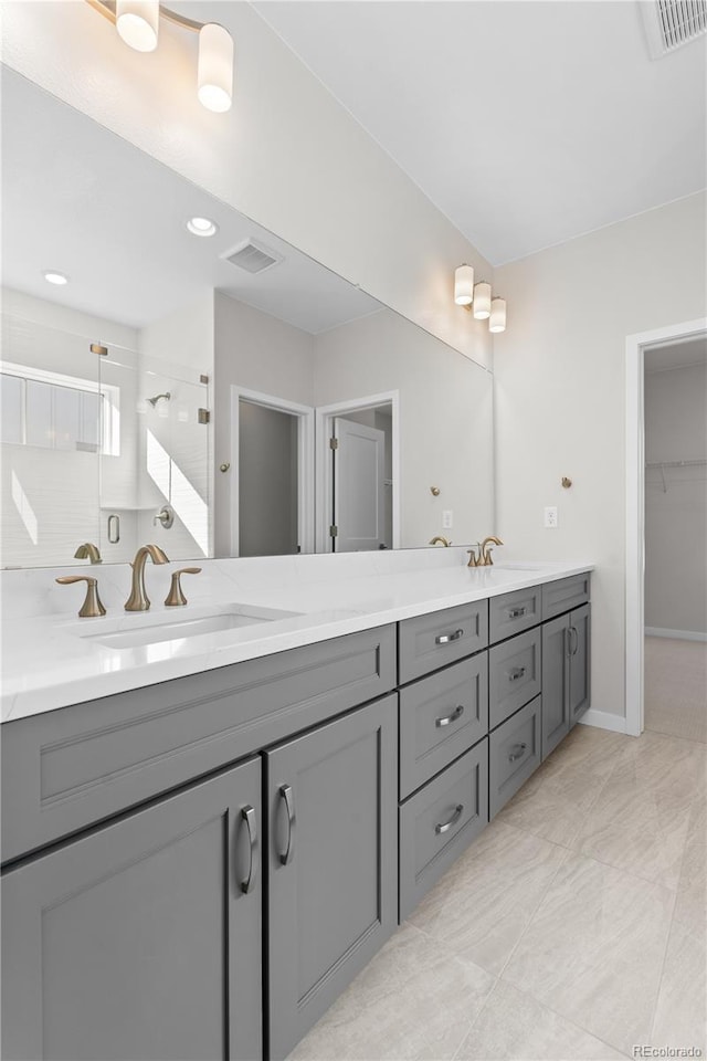 bathroom featuring vanity and walk in shower