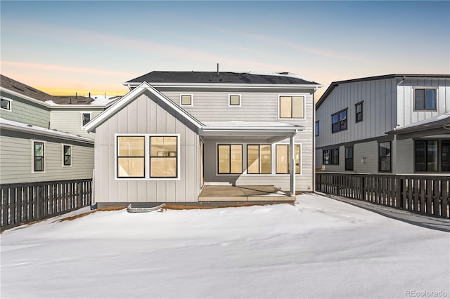 view of snow covered house