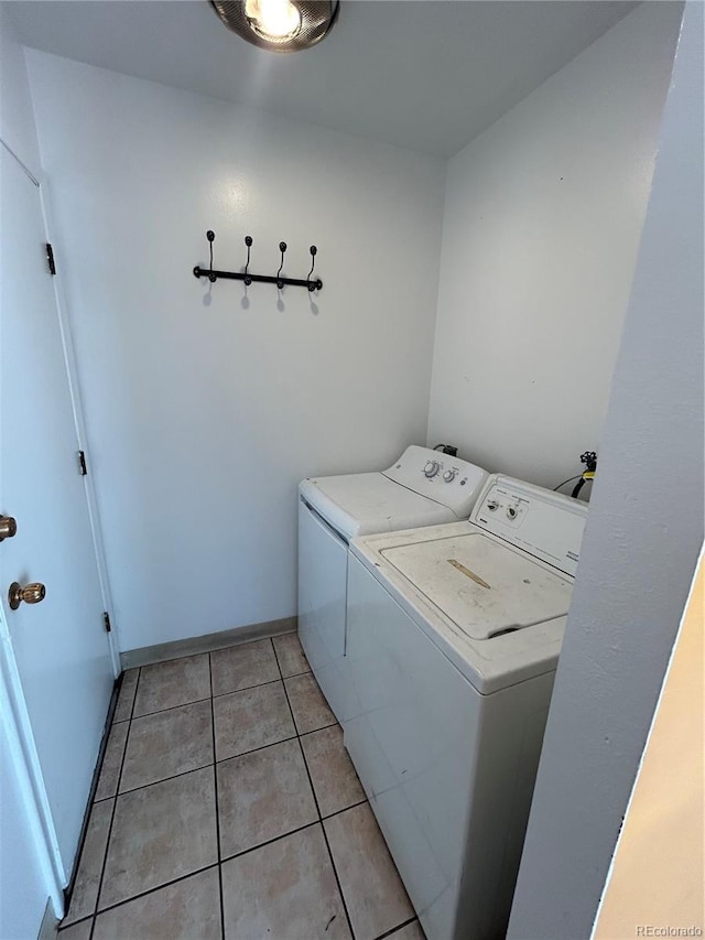 3548 S Hillcrest Dr Unit 2, Denver, CO 80237 - laundry room featuring washer and dryer and light tile patterned floors