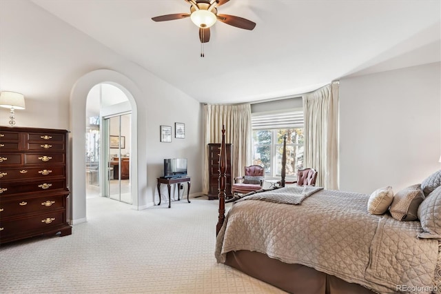 bedroom with ceiling fan and light colored carpet