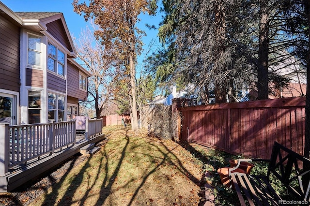 view of yard with a wooden deck