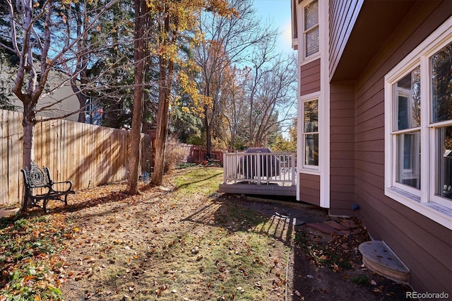 view of yard with a wooden deck