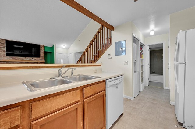 14110 E Dickinson Dr Unit A, Aurora, CO 80014 - kitchen featuring white appliances, a sink, light countertops, electric panel, and lofted ceiling
