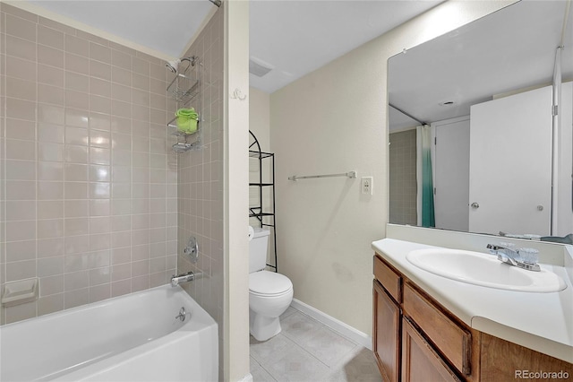 14110 E Dickinson Dr Unit A, Aurora, CO 80014 - bathroom featuring toilet, vanity, tile patterned flooring, baseboards, and shower / bathtub combination
