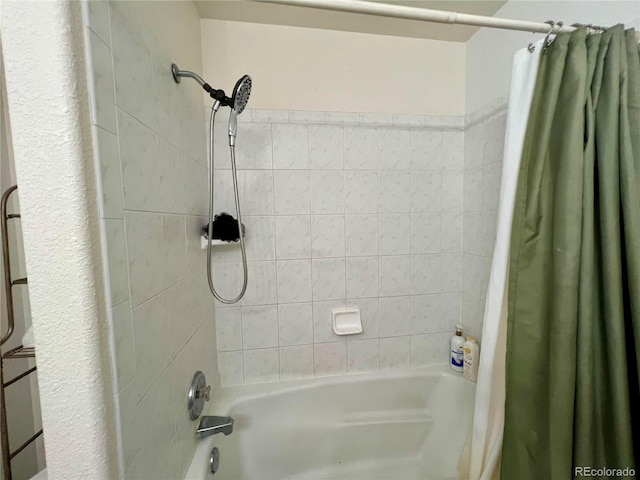 bathroom with shower / tub combo with curtain