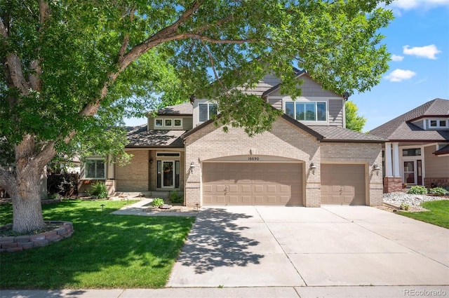 16690 Amberstone Way, Parker, CO 80134 - view of front facade featuring concrete driveway, brick siding, an attached garage, and a front yard