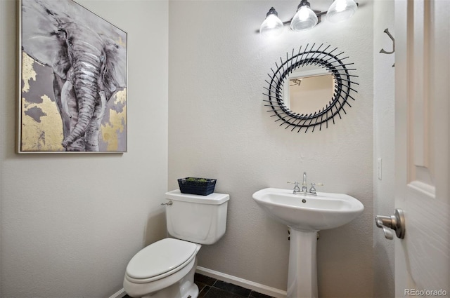 16690 Amberstone Way, Parker, CO 80134 - half bathroom with toilet and tile patterned floors