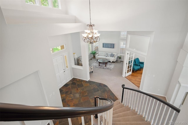 16690 Amberstone Way, Parker, CO 80134 - entrance foyer with a high ceiling, a chandelier, and stairway