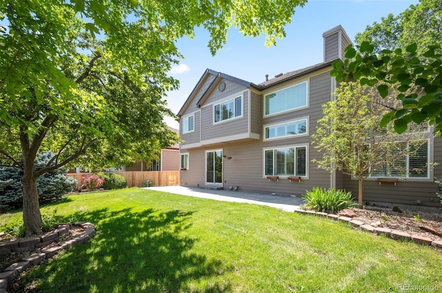 16690 Amberstone Way, Parker, CO 80134 - rear view of house featuring a patio area and a chimney