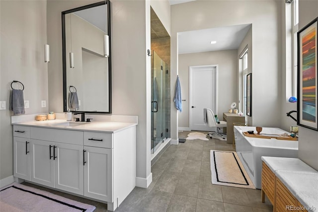 bathroom with separate shower and tub and vanity