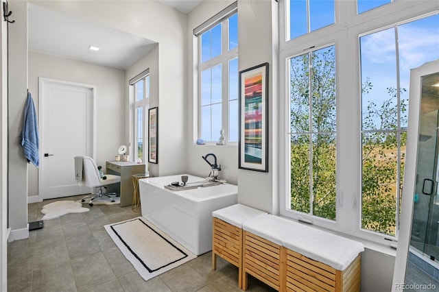 bathroom with tile patterned floors and plus walk in shower