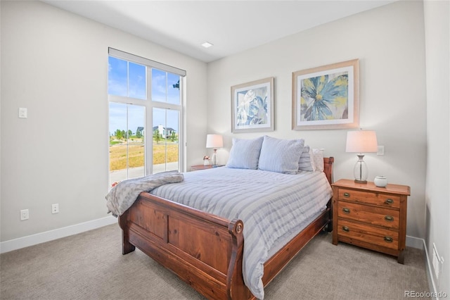 bedroom featuring light carpet