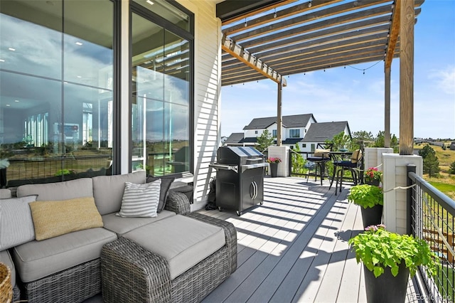 deck featuring a pergola and grilling area