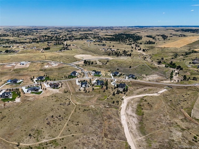 birds eye view of property featuring a rural view