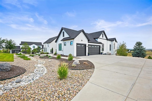 view of side of property featuring board and batten siding, an attached garage, and concrete driveway