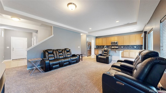 19000 E 55th Ave, Denver, CO 80249 - living room featuring a raised ceiling, recessed lighting, light colored carpet, and stairs