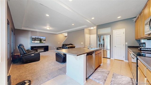 19000 E 55th Ave, Denver, CO 80249 - kitchen featuring stainless steel appliances, open floor plan, light tile patterned floors, a raised ceiling, and dark countertops