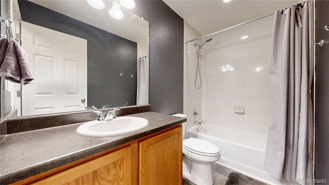19000 E 55th Ave, Denver, CO 80249 - full bathroom featuring shower / bathtub combination with curtain, vanity, and a textured wall