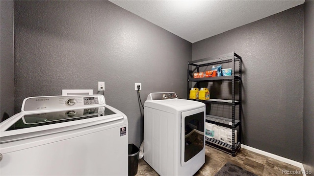 19000 E 55th Ave, Denver, CO 80249 - laundry room with washing machine and clothes dryer and a textured wall
