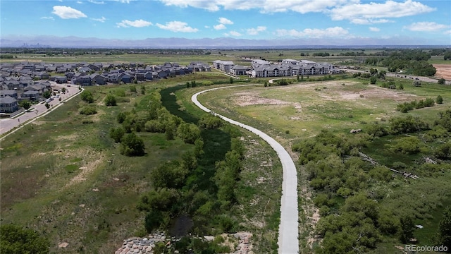 19000 E 55th Ave, Denver, CO 80249 - aerial view of residential area with a mountain backdrop