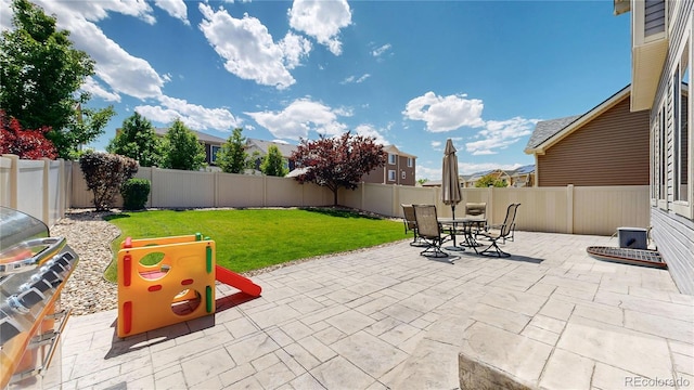 19000 E 55th Ave, Denver, CO 80249 - fenced backyard featuring a patio and outdoor dining space