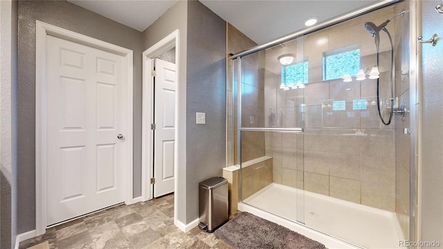 19000 E 55th Ave, Denver, CO 80249 - full bathroom with a shower stall and a textured wall