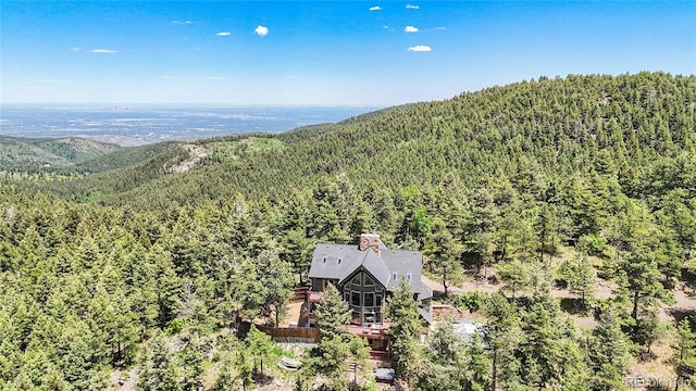14980 Elk Mountain Trl, Littleton, CO 80127 - aerial view of property and surrounding area with a forest and mountains