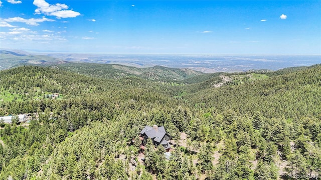 14980 Elk Mountain Trl, Littleton, CO 80127 - bird's eye view of a heavily wooded area and a mountain backdrop