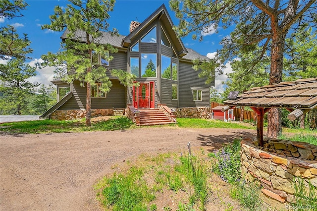14980 Elk Mountain Trl, Littleton, CO 80127 - contemporary house with dirt driveway