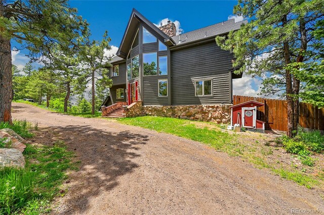 14980 Elk Mountain Trl, Littleton, CO 80127 - view of front facade with a chimney