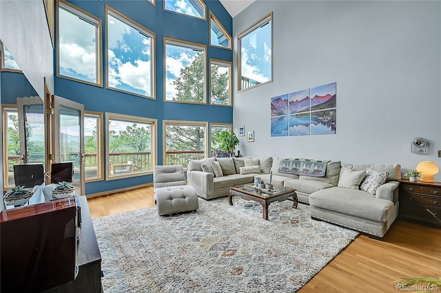 14980 Elk Mountain Trl, Littleton, CO 80127 - living room with a high ceiling and wood finished floors