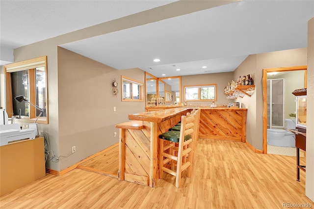 14980 Elk Mountain Trl, Littleton, CO 80127 - kitchen with light wood-style flooring and recessed lighting