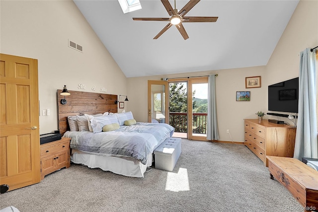 14980 Elk Mountain Trl, Littleton, CO 80127 - bedroom with access to exterior, light carpet, high vaulted ceiling, a skylight, and a ceiling fan