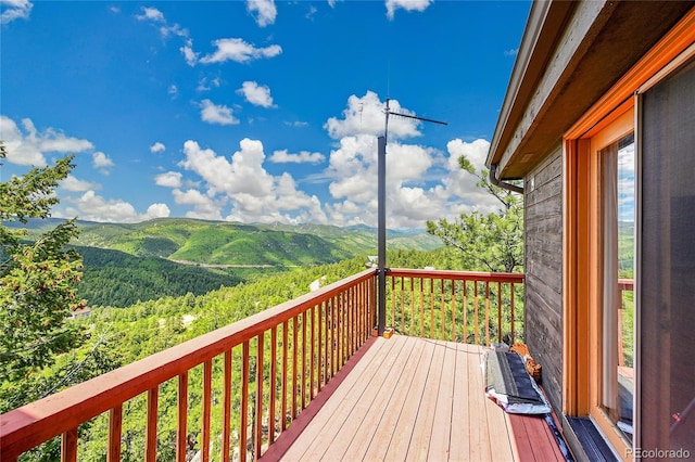 14980 Elk Mountain Trl, Littleton, CO 80127 - wooden deck featuring a mountain view