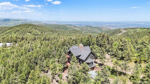 14980 Elk Mountain Trl, Littleton, CO 80127 - view of subject property with a heavily wooded area and mountains