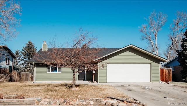 ranch-style home with a garage, driveway, a chimney, and fence