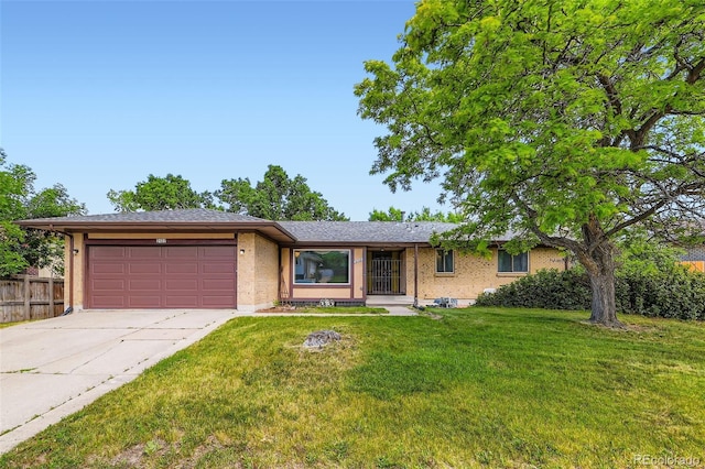 2122 S Yank Way, Lakewood, CO 80228 - ranch-style house with a garage, driveway, and brick siding