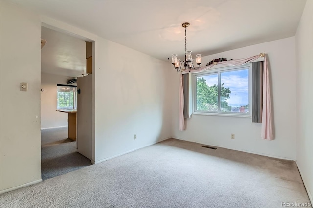 2122 S Yank Way, Lakewood, CO 80228 - carpeted spare room featuring a chandelier