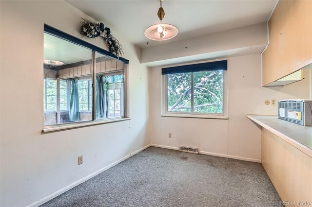 2122 S Yank Way, Lakewood, CO 80228 - unfurnished dining area featuring carpet floors and baseboards