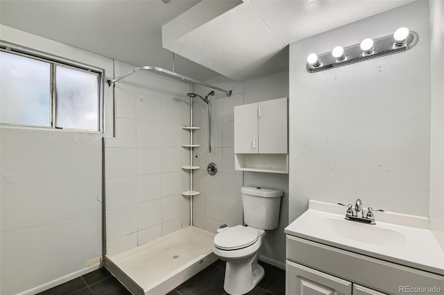 2122 S Yank Way, Lakewood, CO 80228 - bathroom with a shower stall, tile patterned flooring, and vanity