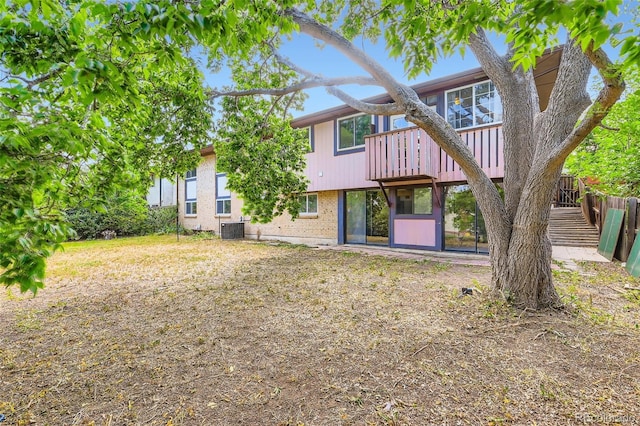 2122 S Yank Way, Lakewood, CO 80228 - back of property with brick siding and a deck