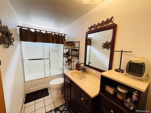 bathroom featuring vanity, shower / bath combination with glass door, a textured ceiling, tile patterned floors, and toilet