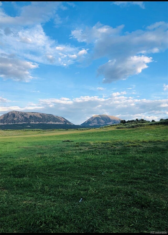 mountain view featuring a rural view