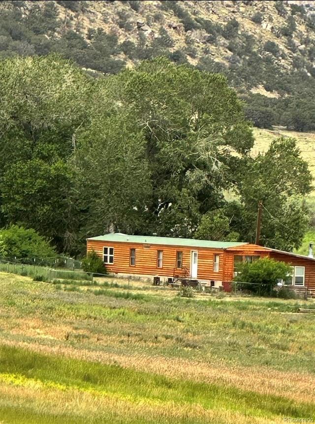 view of front of property featuring faux log siding