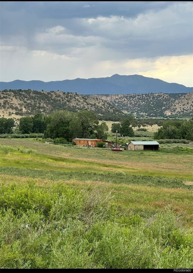 mountain view featuring a rural view