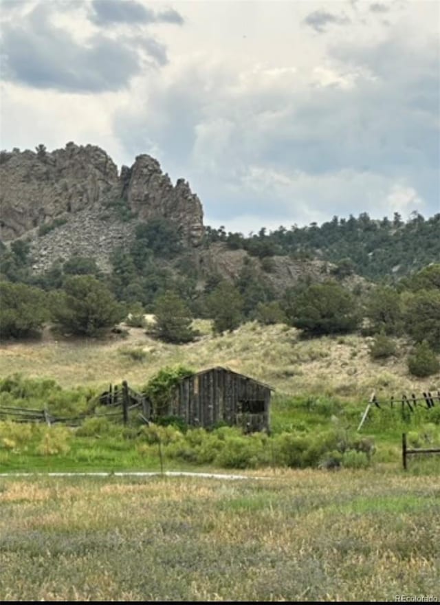 property view of mountains featuring a rural view