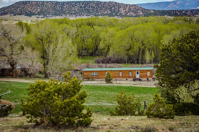 property view of mountains featuring a wooded view